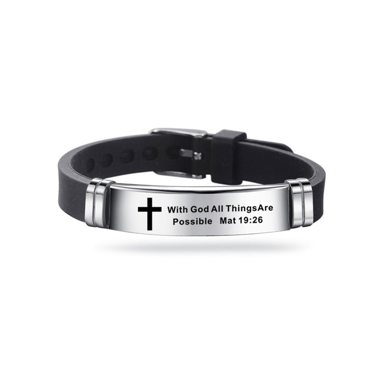 Black and silver bracelet with cross design and engraved text on a white background