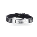 Black leather bracelet with silver tag featuring a cross and engraved text on a white background