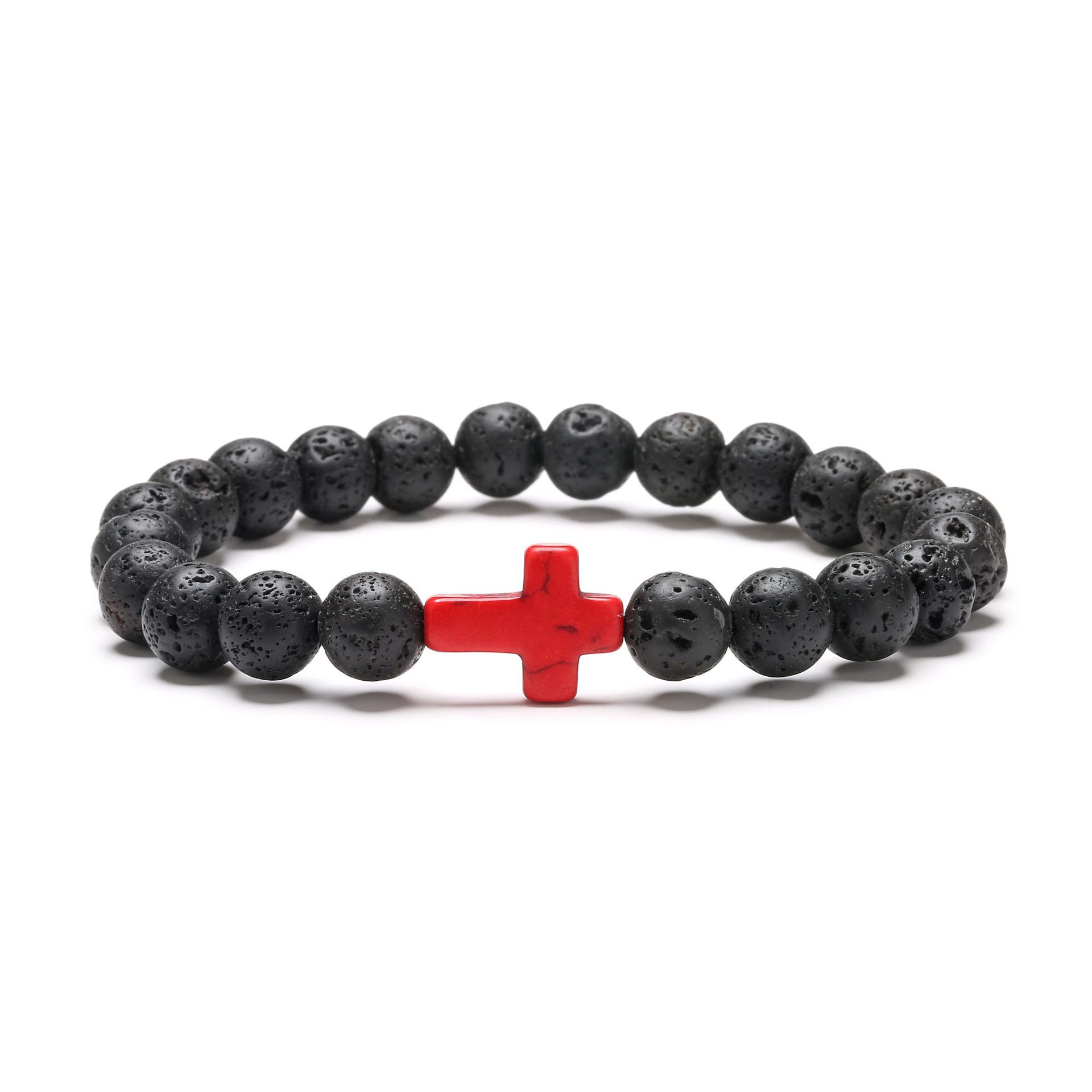 Black beaded bracelet with a red cross charm on a white background
