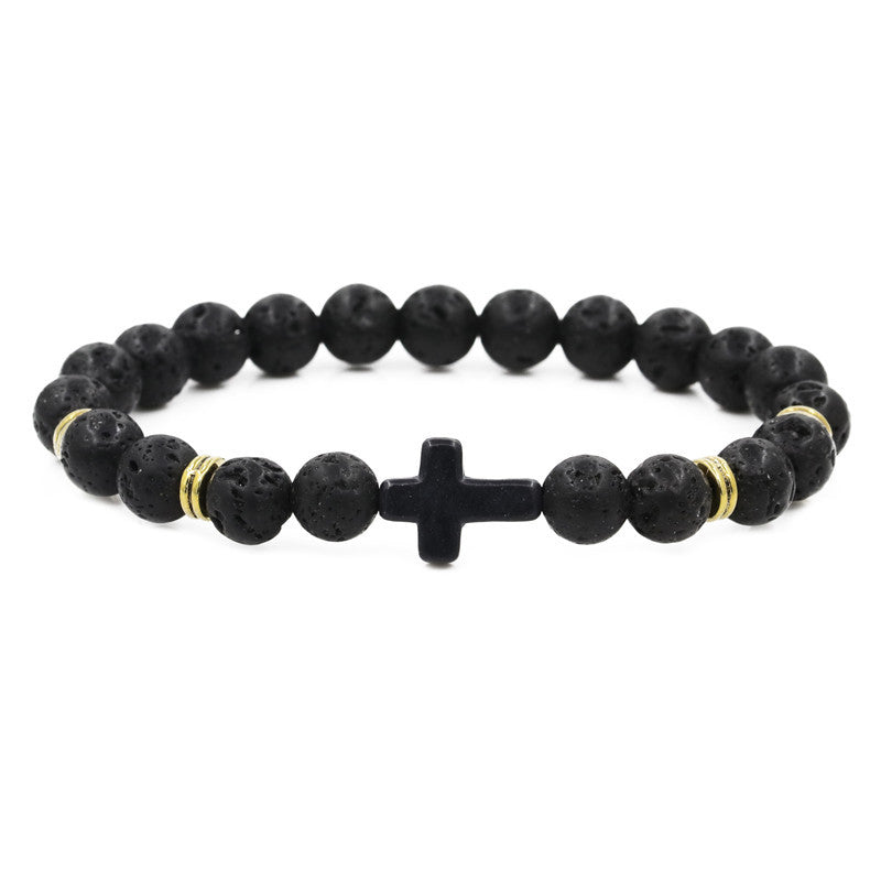 Black beaded bracelet with a central cross charm on a white background