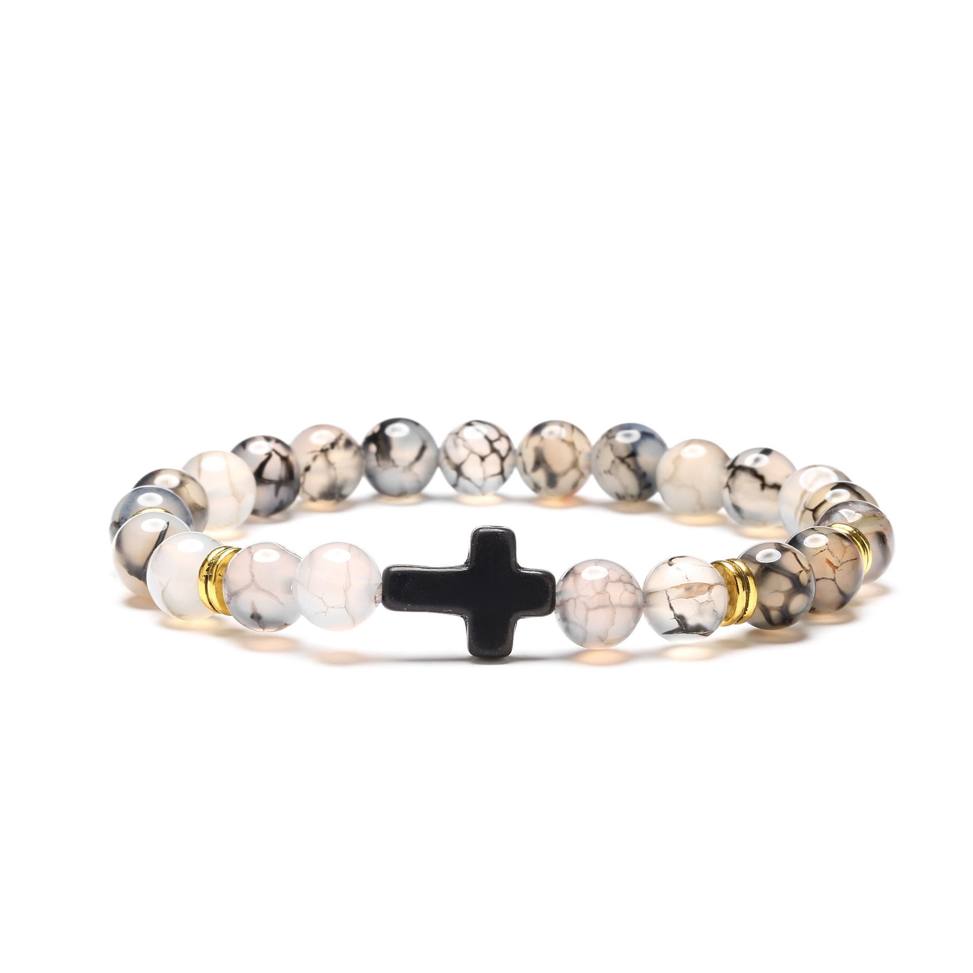 Bracelet with beaded design and black cross on a white background