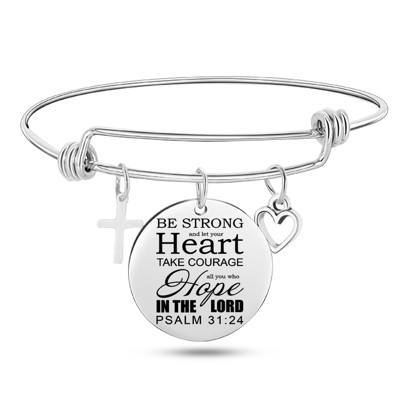 Silver bracelet with a circular charm featuring a Bible verse and religious symbols on a white background